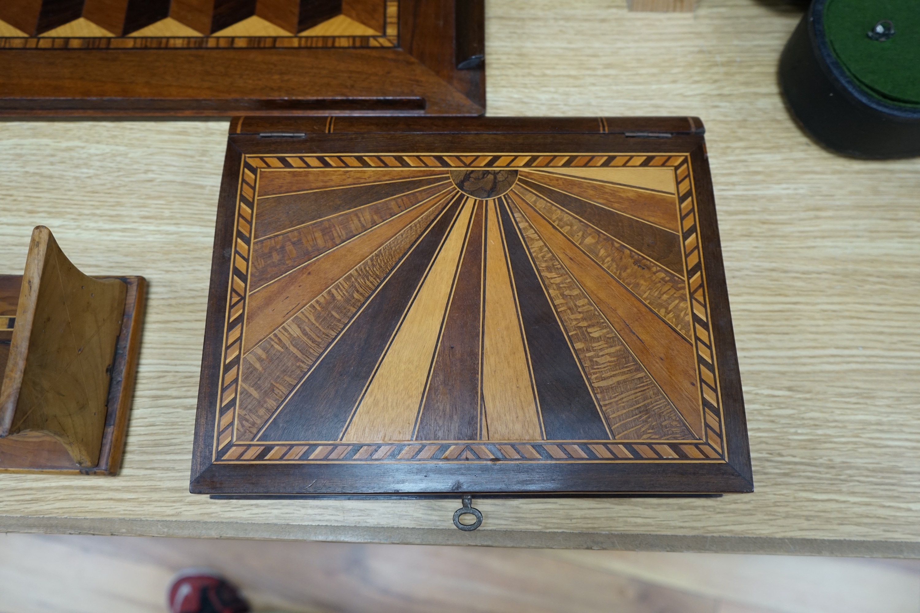 A specimen wood marquetry 'sunray' box, a marquetry tray and a Killarney yew wood bookrest, largest piece 46cm wide. Condition - some scuffs, otherwise good